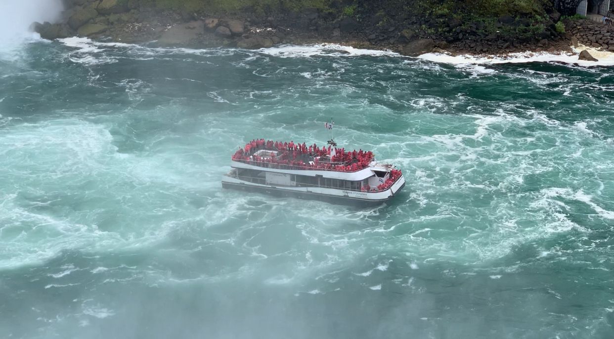 Tourists gather at the scenic border overlooking Niagara Falls, marveling at the breathtaking view that bridges the United States and Canada. A global destination, the falls attract millions of visitors annually, offering a glimpse of nature's raw power and beauty. Photo: Tanvir, Voice7 News